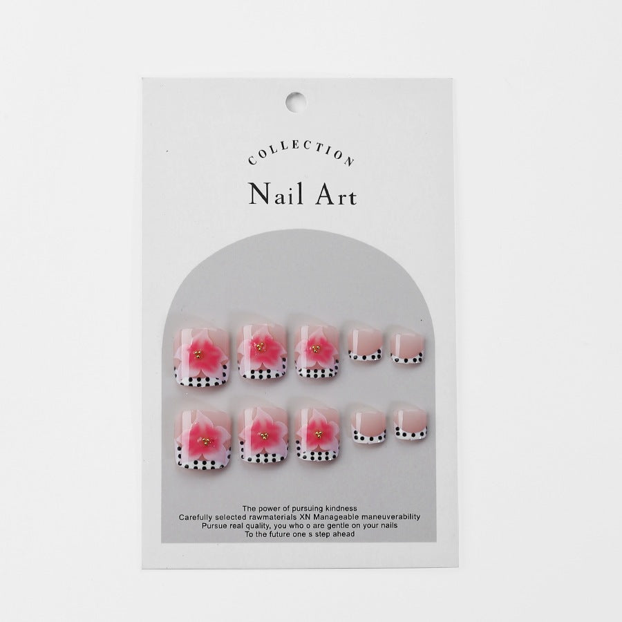 Kunstnagelset mit eleganten Blüten- und Punkte-Design Karnz