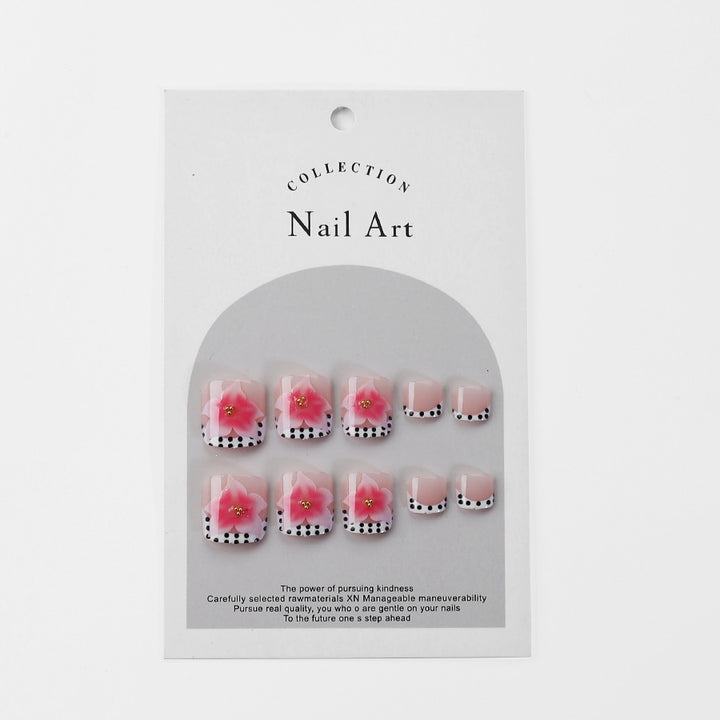 Kunstnagelset mit eleganten Blüten- und Punkte-Design Karnz