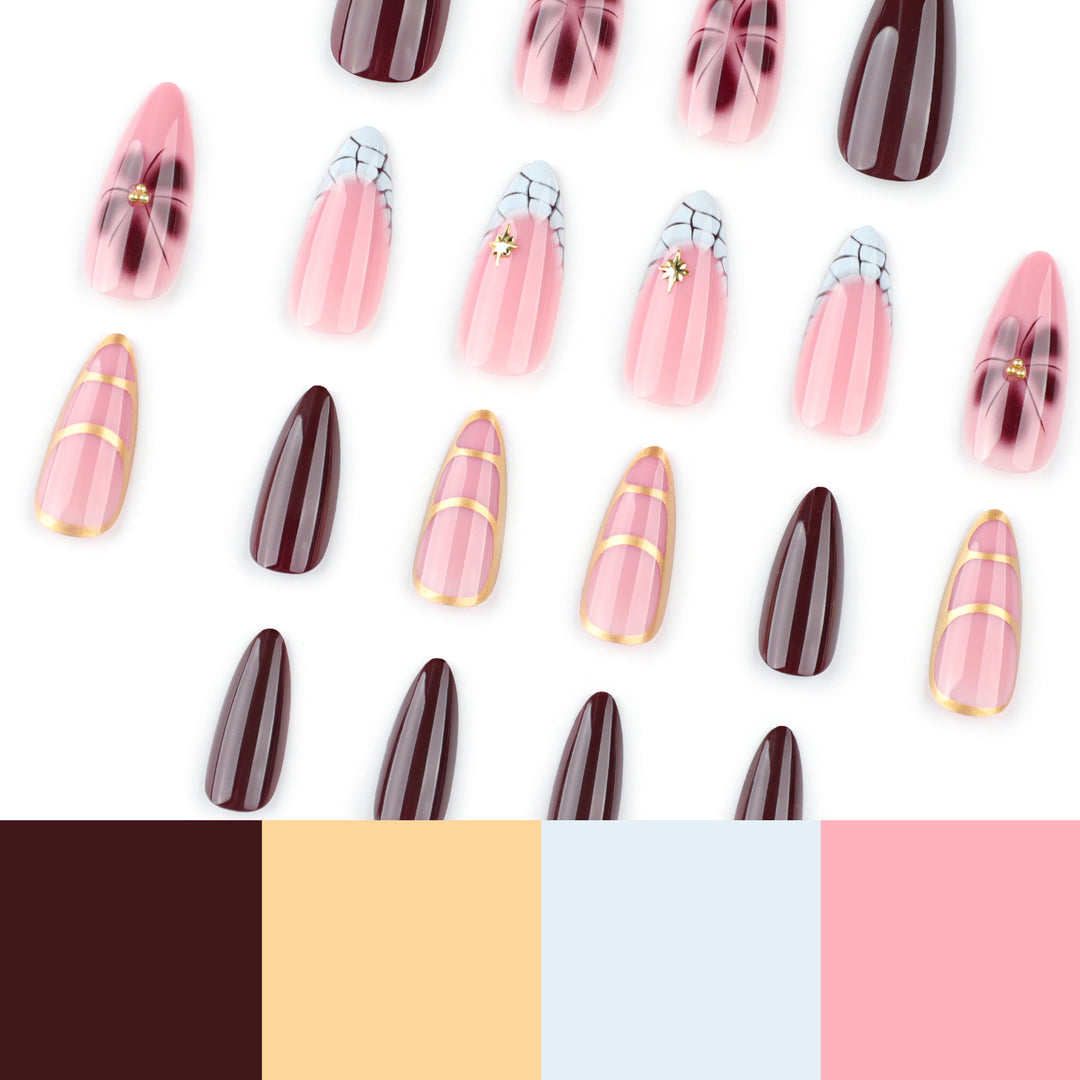 Kunstvolle Stiletto-Nägel mit Goldakzenten und dekorativen Blumenmotiven Karnz