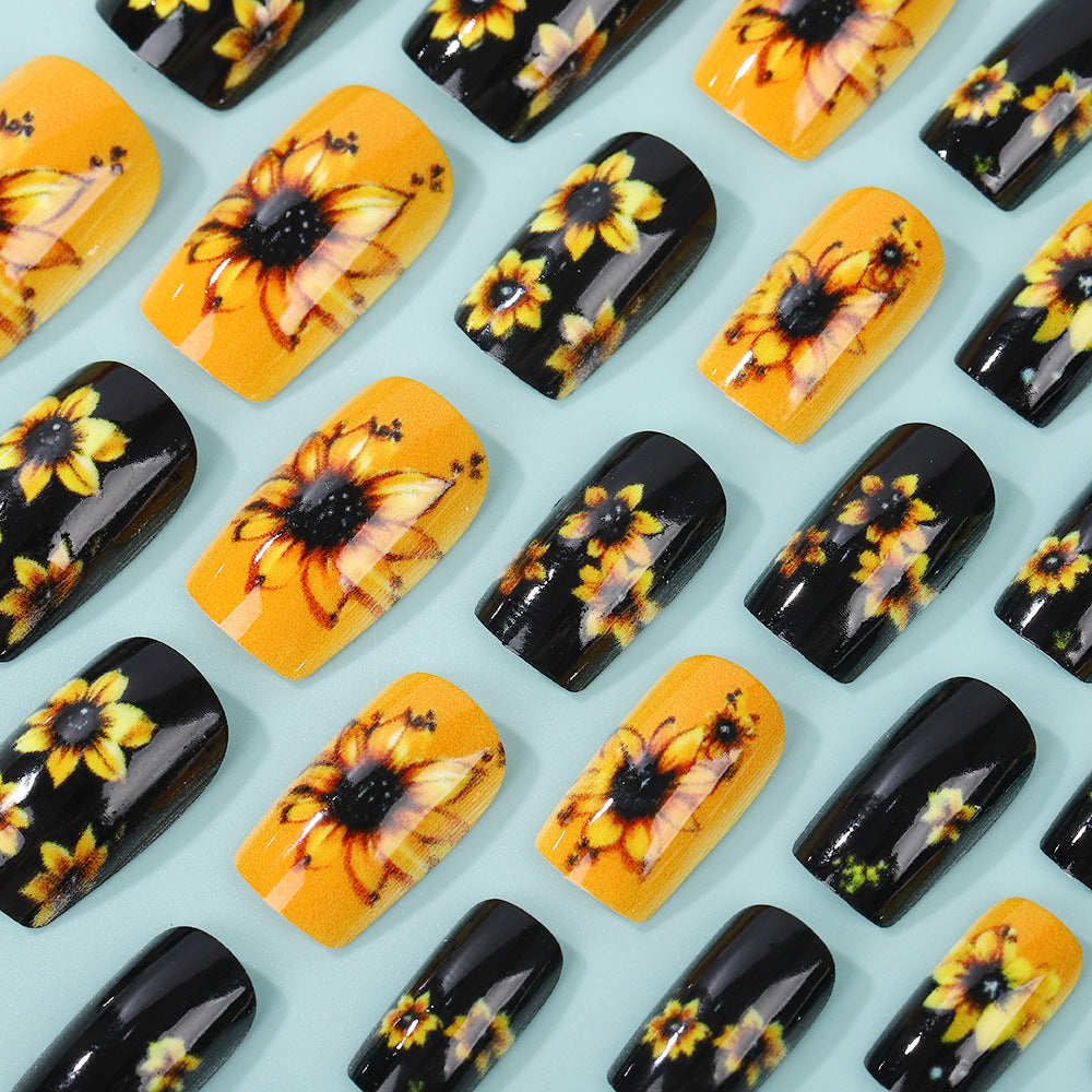 Kunstnägel im floralen Design mit Sonnenblumenmotiv Karnz