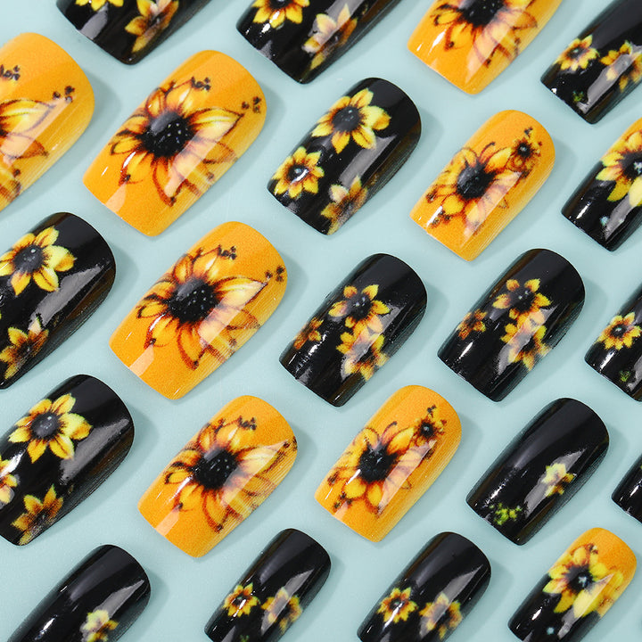 Kunstnägel im floralen Design mit Sonnenblumenmotiv Karnz