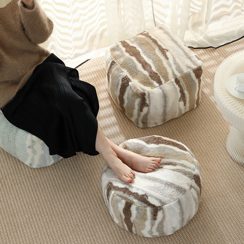 Rundes Sitzpouf aus Teddy‑Fleece mit weichem Strukturbezug
