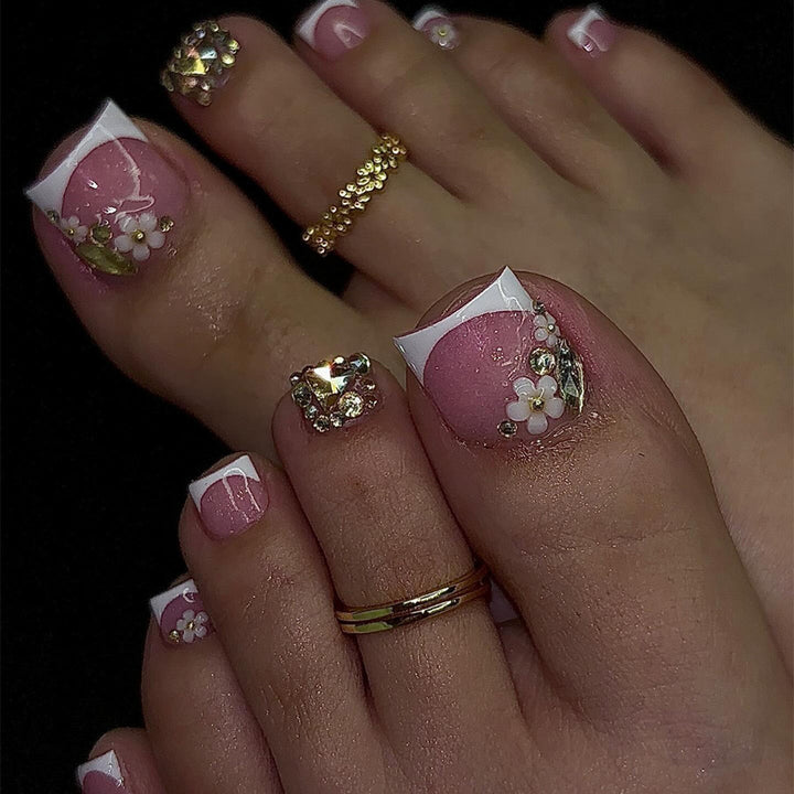 Kunstnagelset mit eleganten 3D-Blüten und Glitzerakzenten Karnz