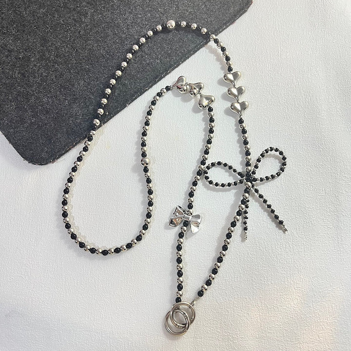 Elegante Perlen- und Kettenhalskette Karnz