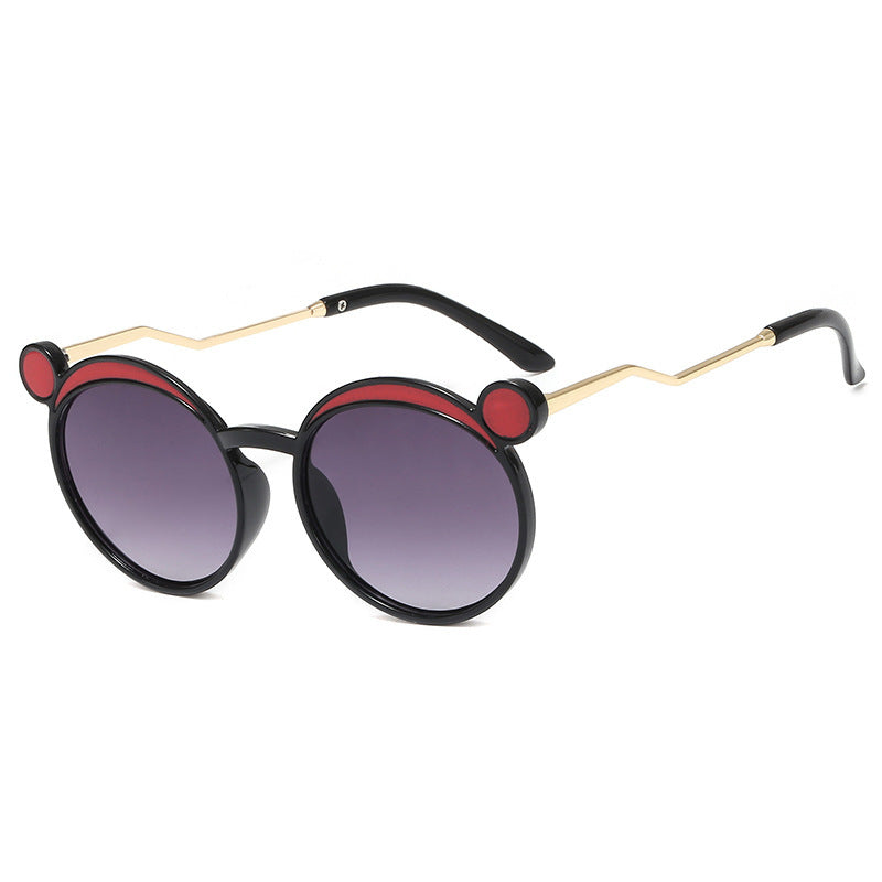 Damen Fashion-Runde Sonnenbrille mit innovativem Rahmen und farbigen Gläsern Karnz