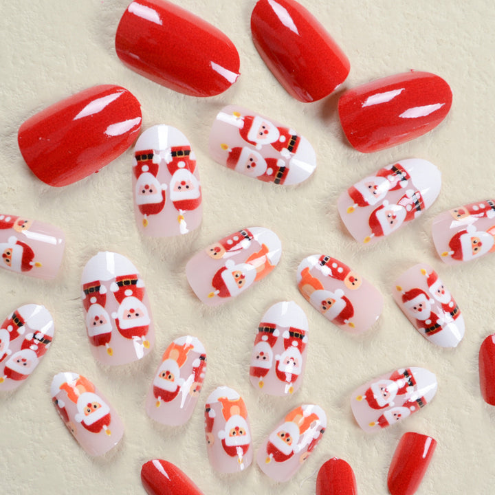 Kunstnagelset im festlichen Weihnachtsdesign mit niedlichen Motiven Karnz