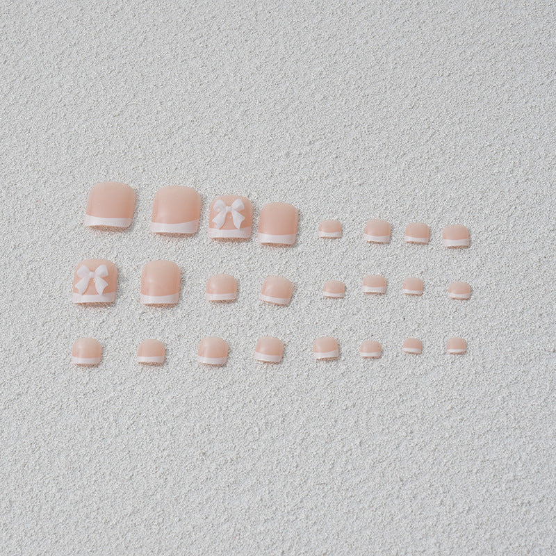 Kunstnagelset mit romantischen Schleifenmotiven Karnz