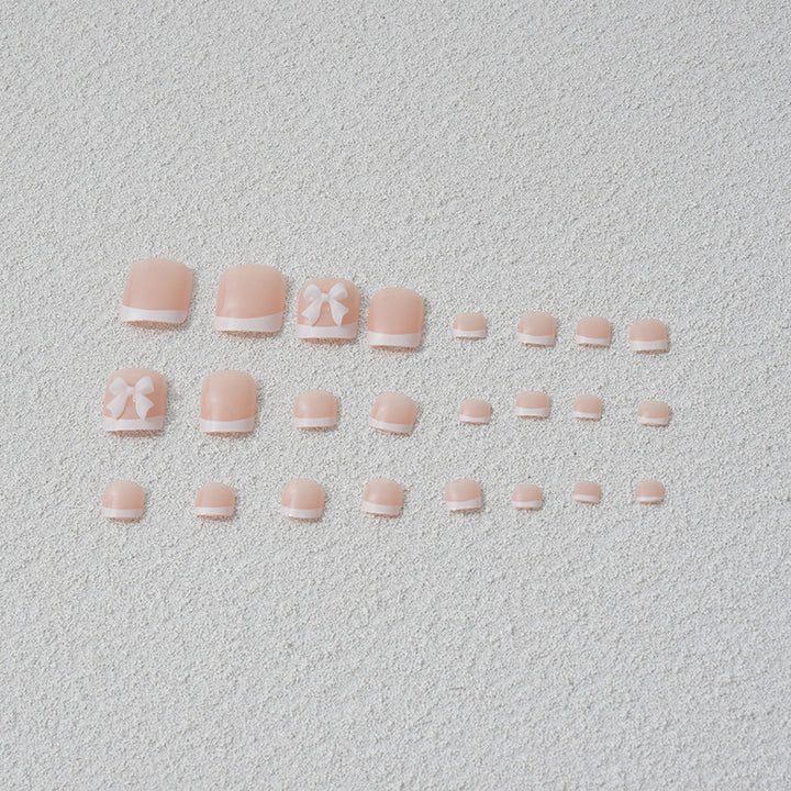 Kunstnagelset mit romantischen Schleifenmotiven Karnz