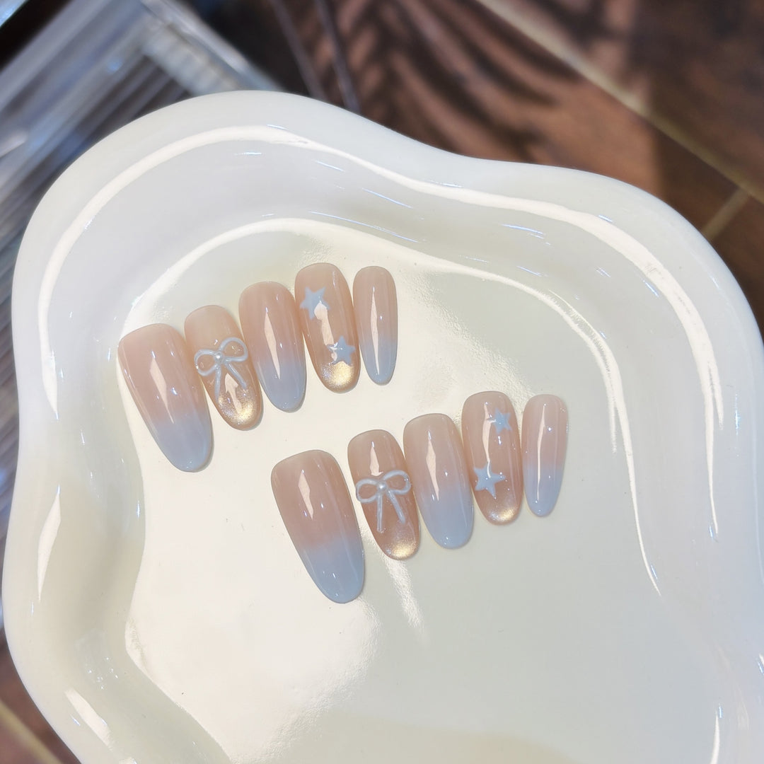 Elegante Kunstnagelset mit Schleifen- und Sternendesigns Karnz