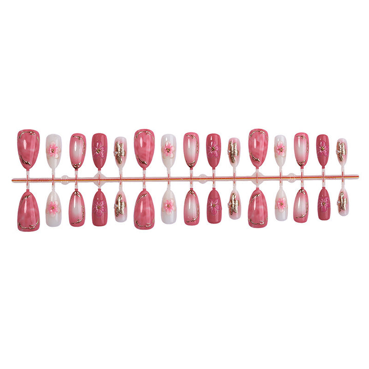 Kunstnagelset mit eleganten Blüten- und Glitzerdetails Karnz