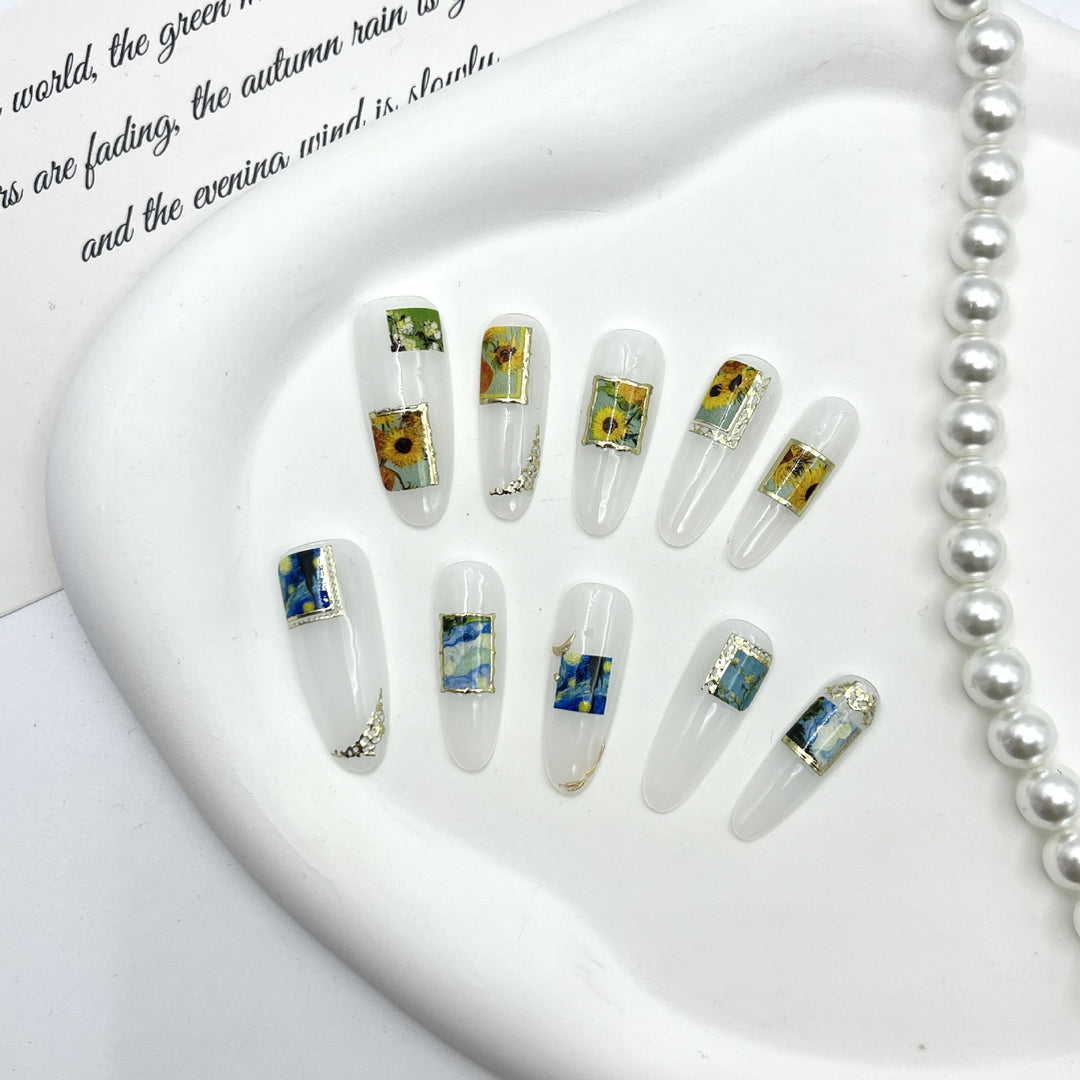 Künstlerisches Press-On Nagelset mit floralen und landschaftlichen Designs