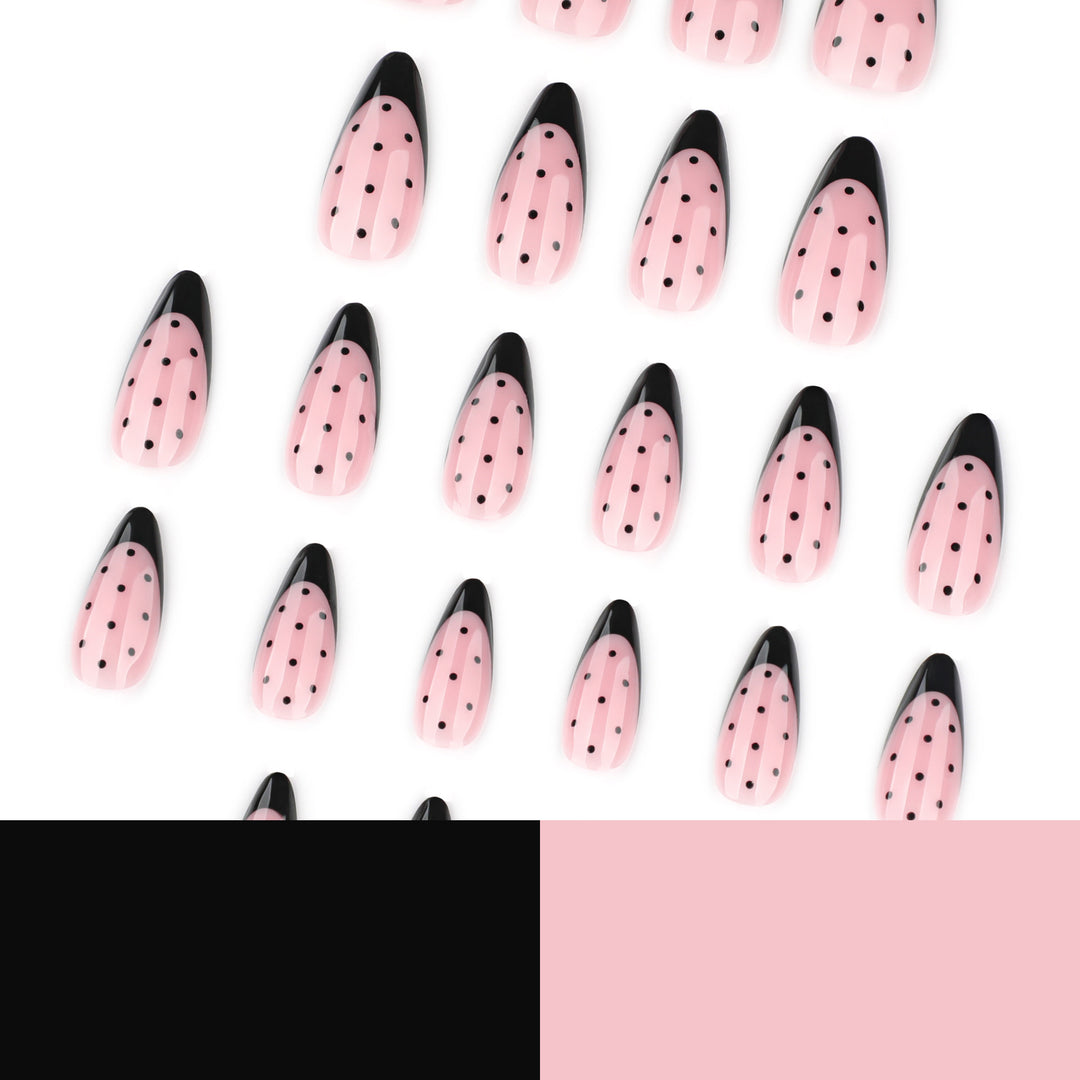 Kunstvolle Stiletto-Nägel mit Schwarz-Punkt-Muster Karnz