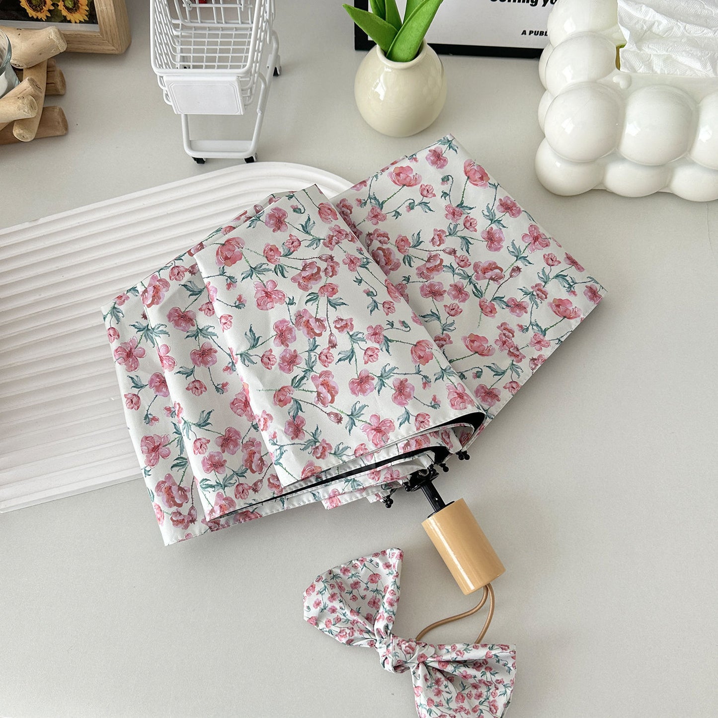 Damen Faltregenschirm mit floralem Design und praktischem Aufbewahrungssystem Karnz