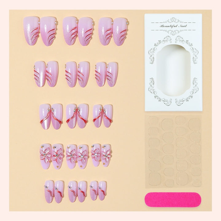 Kunstnagelset mit eleganten Blüten- und Glitzermotiven Karnz