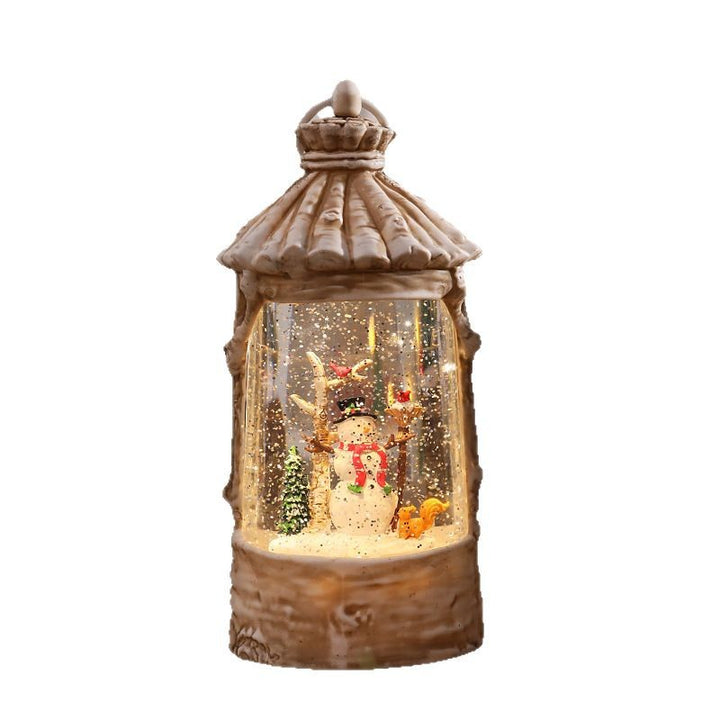 Beleuchtete Weihnachtslaterne mit Schneeszenen Karnz