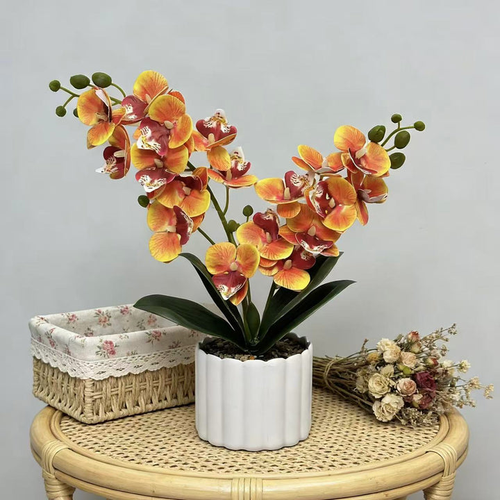 Elegante künstliche Orchideenpflanzenanordnung für die Innendekoration