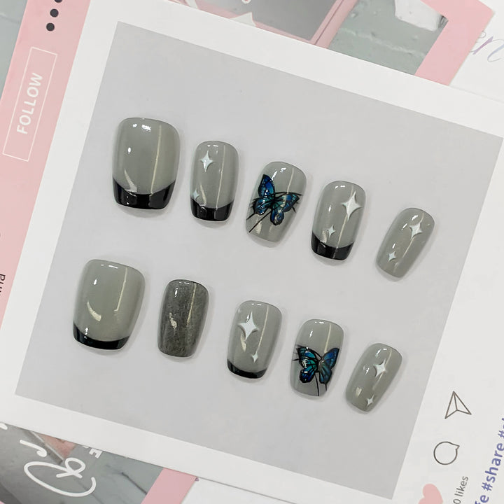 Kunstvolle Nagelspitzen mit Schmetterlings-Motiven Karnz