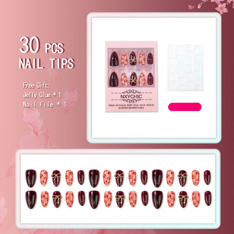 Künstlerisches Press-On-Nagel-Set mit Leoparden- und Bogen-Designs