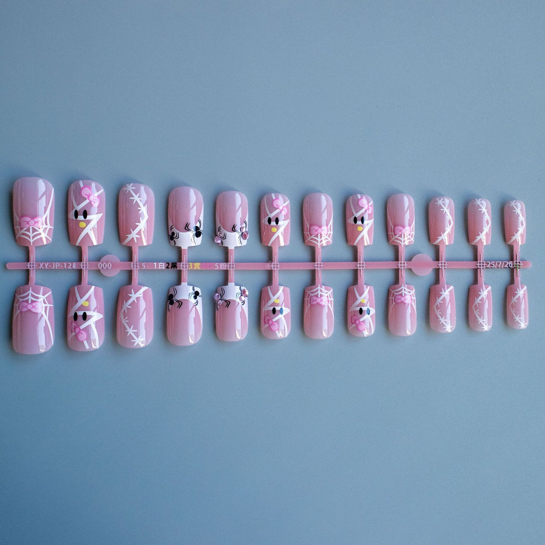 Dekoratives Nagelkunst-Set mit Schleife und Spinnennetzdesign