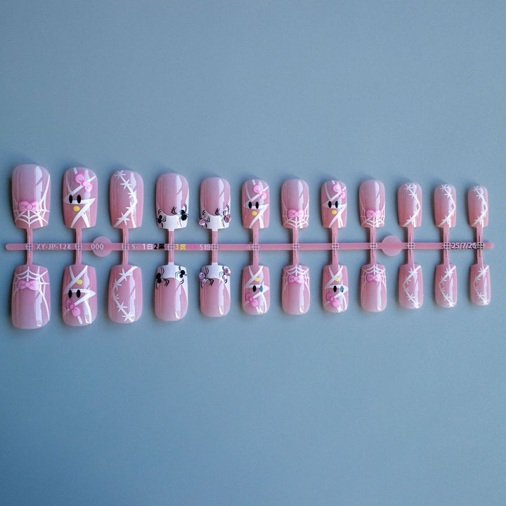 Dekoratives Nagelkunst-Set mit Schleife und Spinnennetzdesign