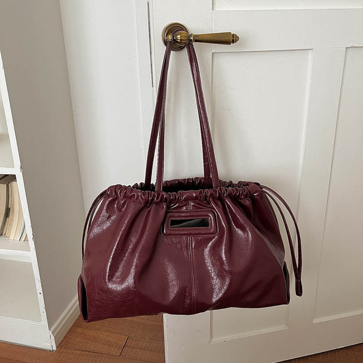 Elegante geraffte Lederhandtasche