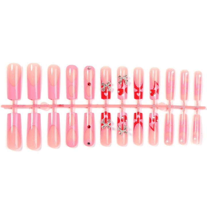 Kreatives Kunstnagelset mit Glitzer- und Herzmotiven Karnz