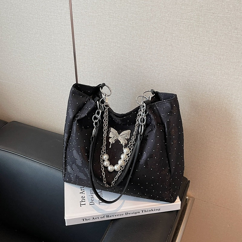 Elegante Handtasche mit Perlendetails Karnz