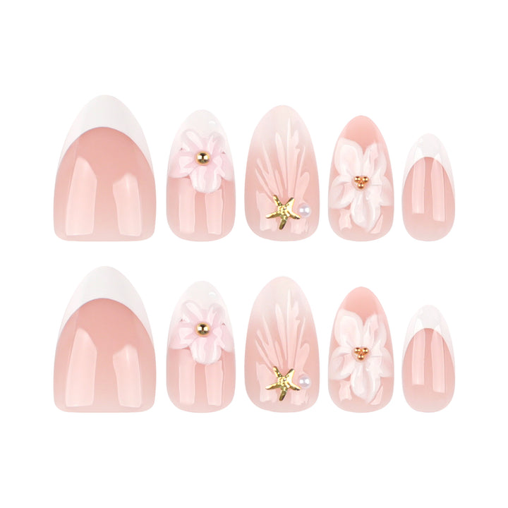 Elegante Kunstnägel mit floralem Design und Glitzerakzenten Karnz