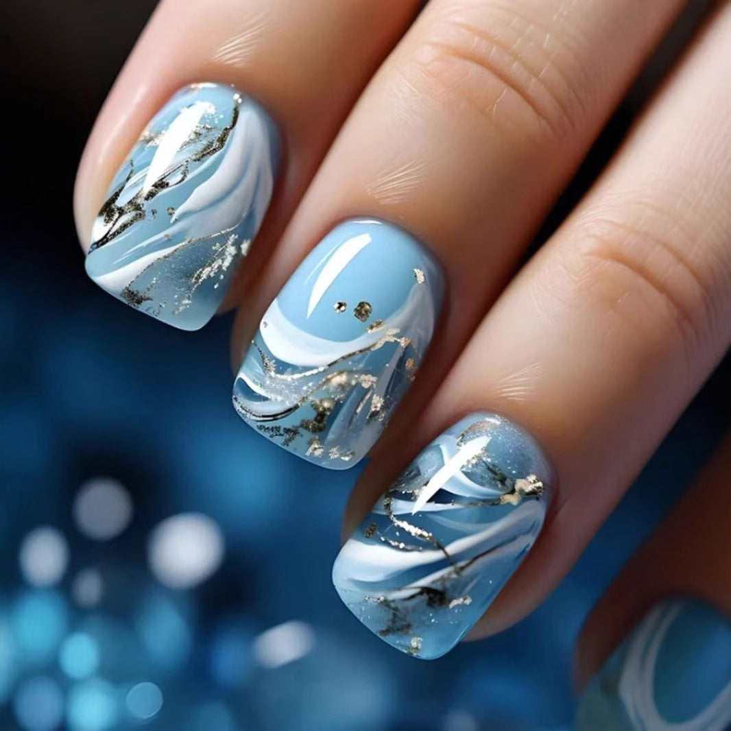 Kunstnagelset mit luxuriösem Marmor-Design und Goldakzenten Karnz