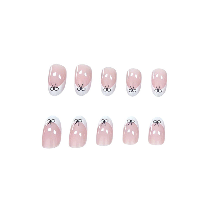 Künstlerische Schleifen-verzierte Nagelkunst Karnz