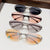 Damen modische Sonnenbrille im futuristischen Design mit verspiegeltem Rahmen Karnz