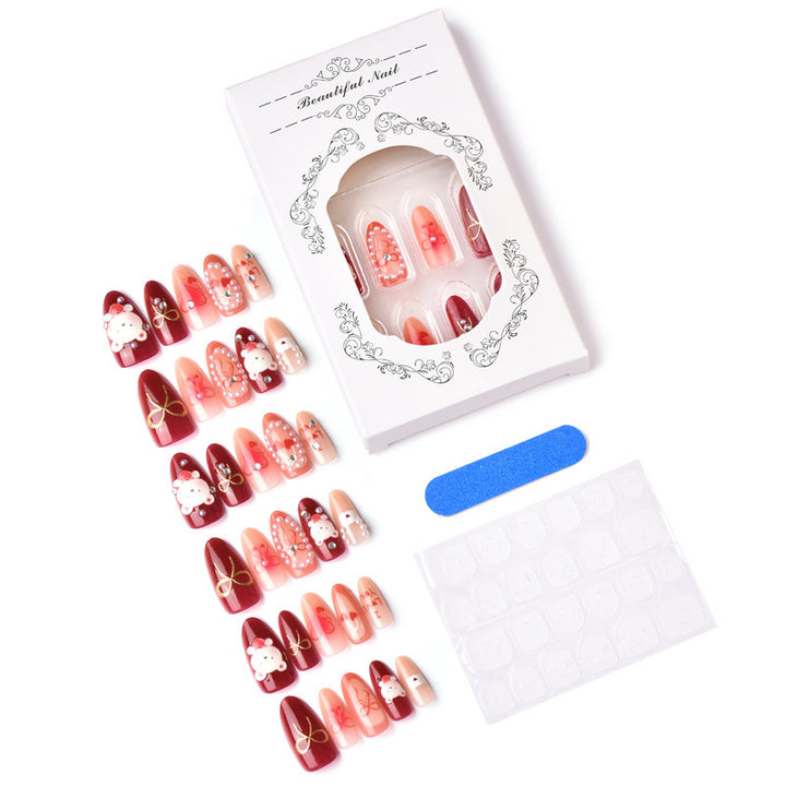 Kunstvolle Nagelset mit liebevollen Motiven Karnz