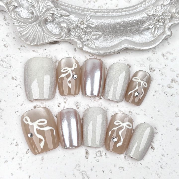Elegantes Press-On Nagelkunstset mit Schleifenakzenten