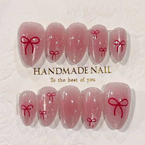 Künstliche Nagelkunst mit Schleifenmotiv Karnz