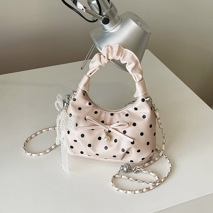 Verspielte gepunktete Handtasche