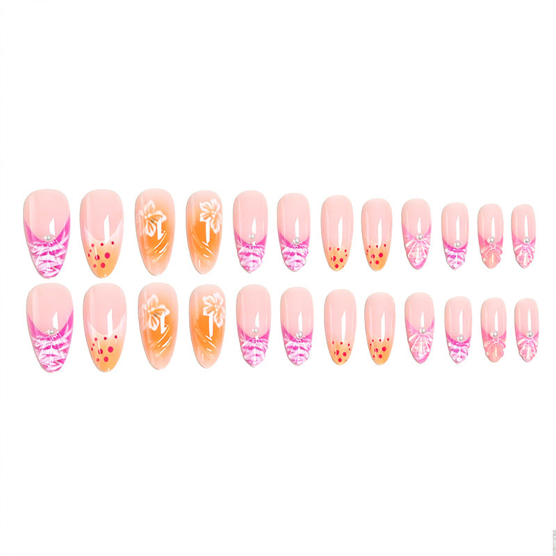 Kunstnagelset mit exotischen Blumenmustern und Glitzerakzenten Karnz