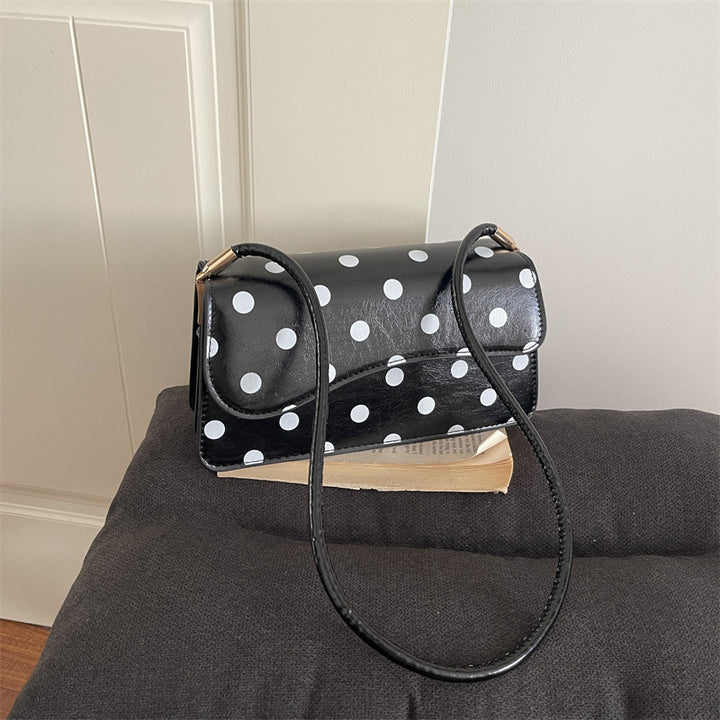 Schicke gepunktete Schultertasche