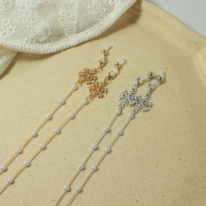 Elegante Brillenhalterkette mit Perlen und Schneeflockenanhänger Karnz