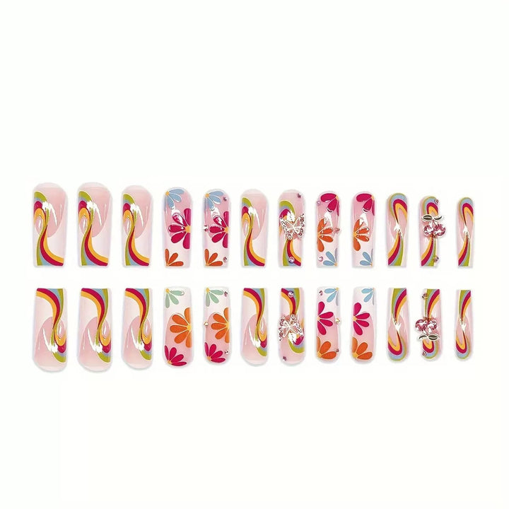 Kunstnagelset mit leuchtenden Blumenmotiven und Glitzerakzenten Karnz
