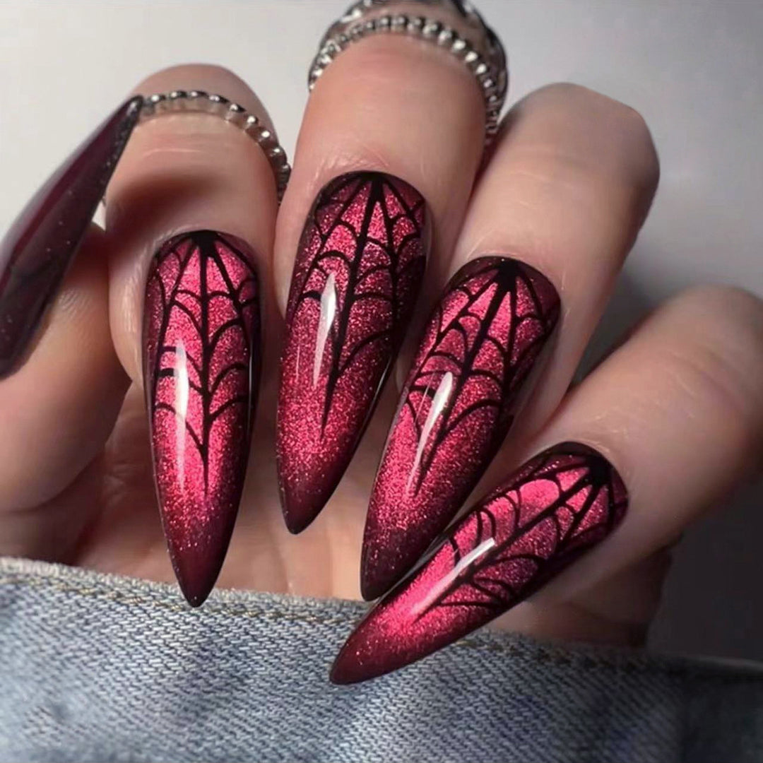 Kreative Stiletto-Nagelkunst mit blutroten Akzenten Karnz