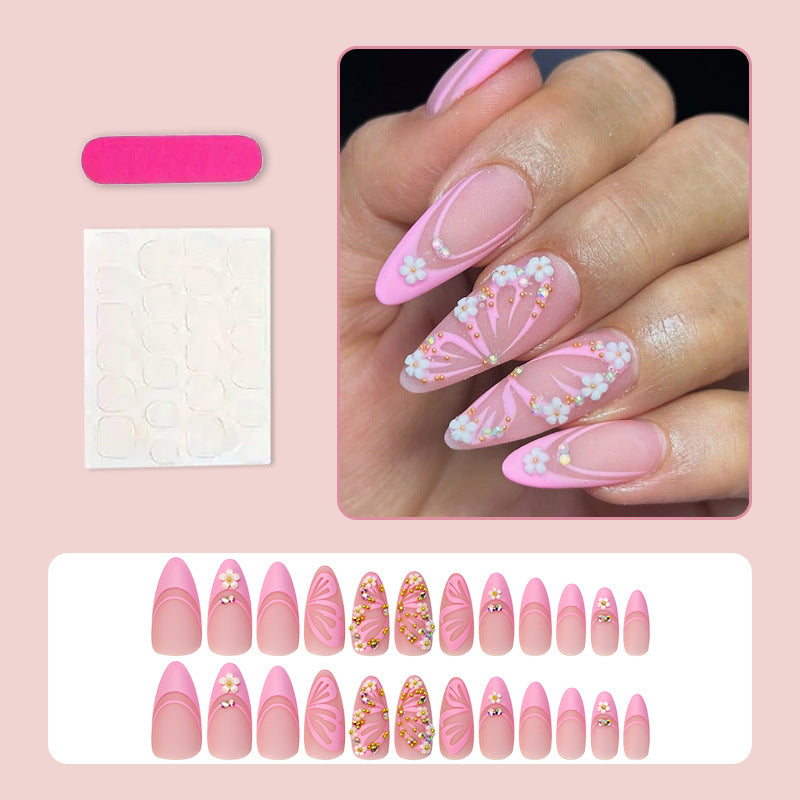 Kunstnagelset mit eleganten blauen und nude Farbakzenten Karnz