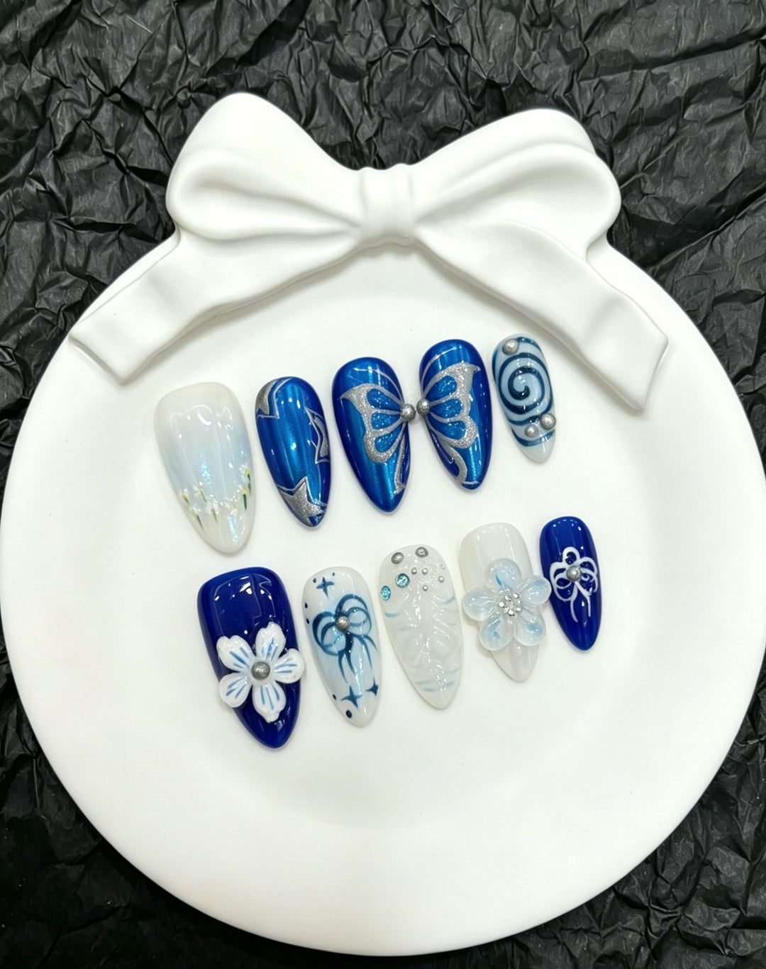 Dekorative Schmetterlings Press-On Nagelkunst Kollektion