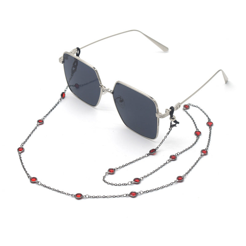 Stylische quadratische Sonnenbrille mit dekorativer Kette Karnz
