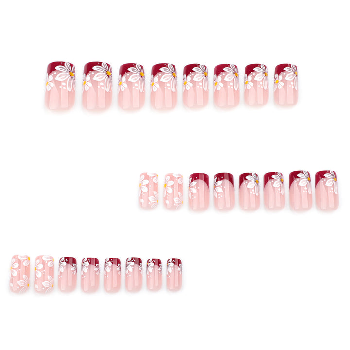 Kunstvolle Nagelverlängerungen mit Blumenmotiv Karnz