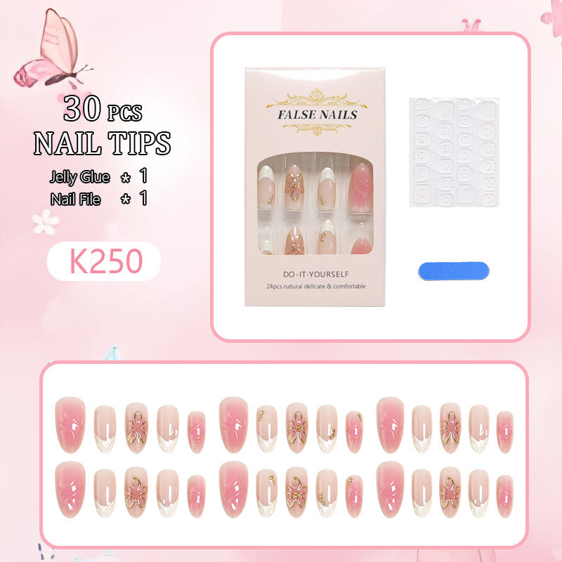 Kunstnagelset mit eleganten Blüten- und Glitzerelementen Karnz