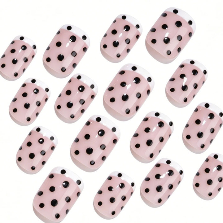 Kunstnagelset mit eleganten Punkten und französischen Spitzen Karnz