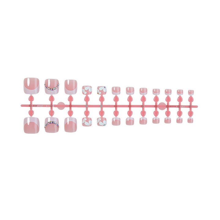 Kreatives Kunstnagelset mit eleganten Blumen-Designs und Glitzerakzenten Karnz