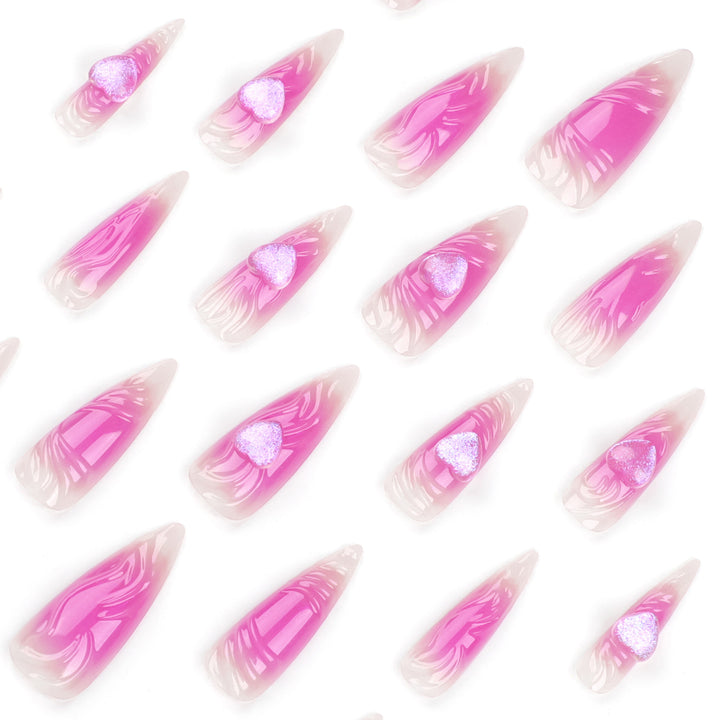Kunstvolle Stiletto-Nägel mit Herz-Design und Glitzerakzenten Karnz