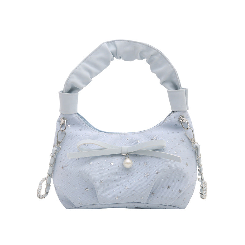 Elegante Handtasche mit Schleifendetail und Sternenprint