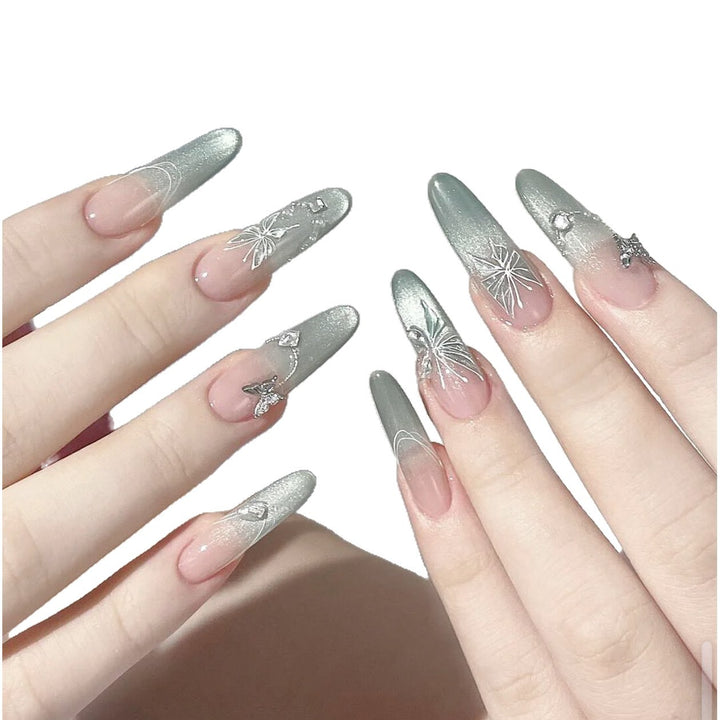 Dekoratives Stiletto Press-On Nagelset mit künstlerischen Blumen- und Edelsteinakzenten Karnz
